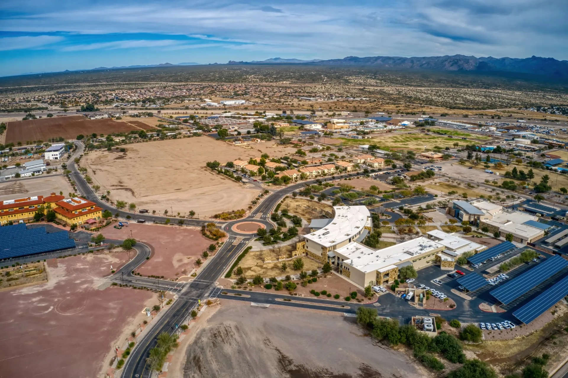 Aerial view of Phoenix, Arizona showing desert development, roadways and open graded land
